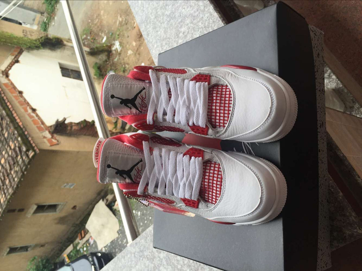 Jordan 4 Retro White and Red High-Top Sneakers