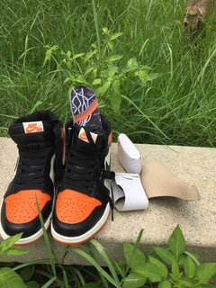 Jordan 1 High Sneakers in Black, White and Orange