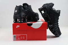 Nike Shox TL Sneakers in Black and Gold